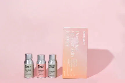 Eco-friendly refillable skincare bottles and box on pink background, waterless low-tox solid bar alternative