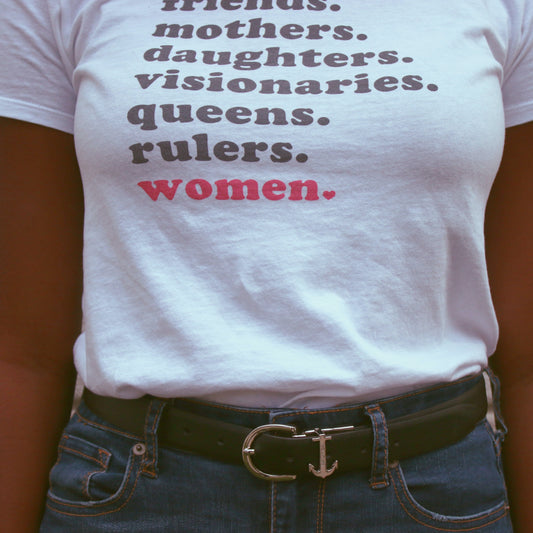 Woman wearing a white t-shirt with empowering words. International Woman's day